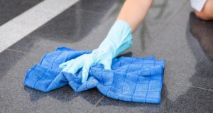 Limpiezas de obra nueva profesionales Young Maid Cleaning The Floor